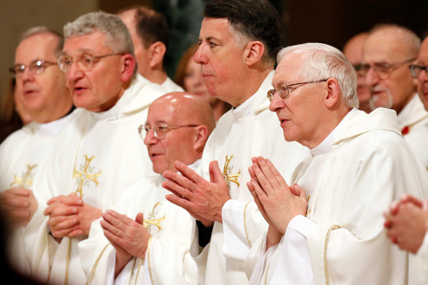 Archbishop Leonard P. Blair of Hartford, Conn., right, prays with fellow bishops during the opening Mass of the National Prayer Vigil for Life Jan. 17 at the Basilica of the National Shrine of the Immaculate Conception in Washington.
